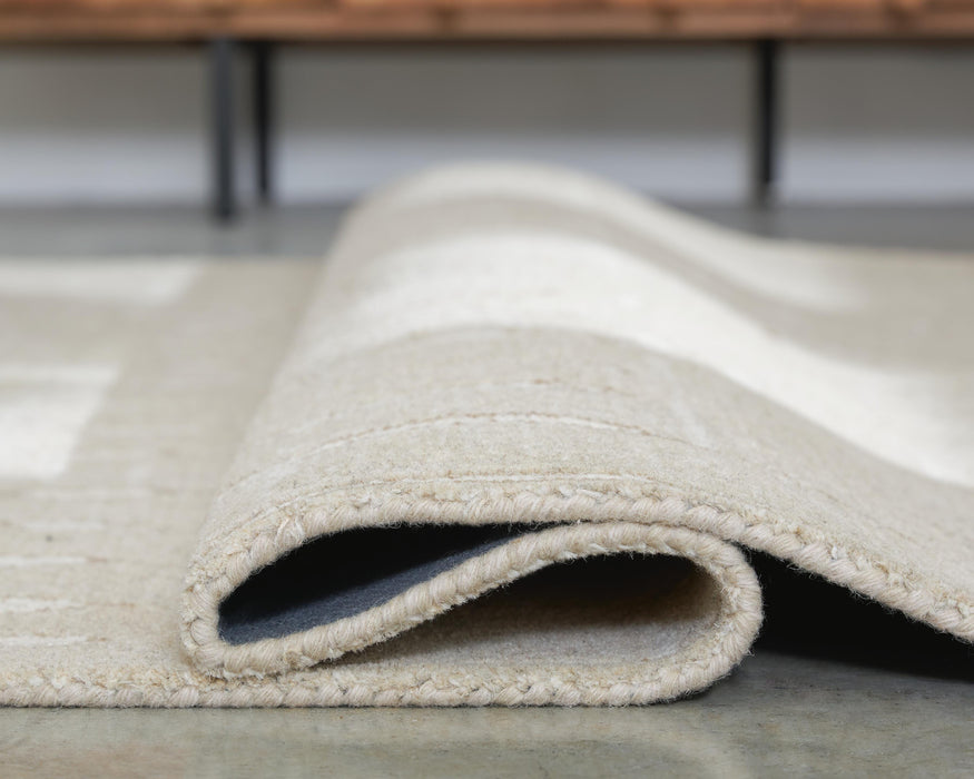 Wolbert 7'8" x 10' Area Rug - Pierce Furniture Gallery