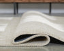 Wolbert 7'8" x 10' Area Rug - Pierce Furniture Gallery